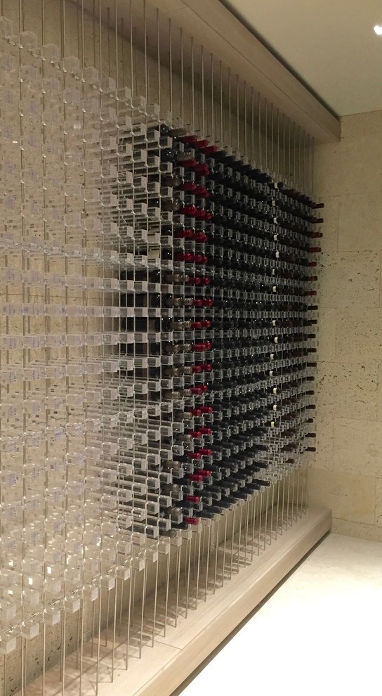 Contemporary wine cellar in San Diego with storage racks.