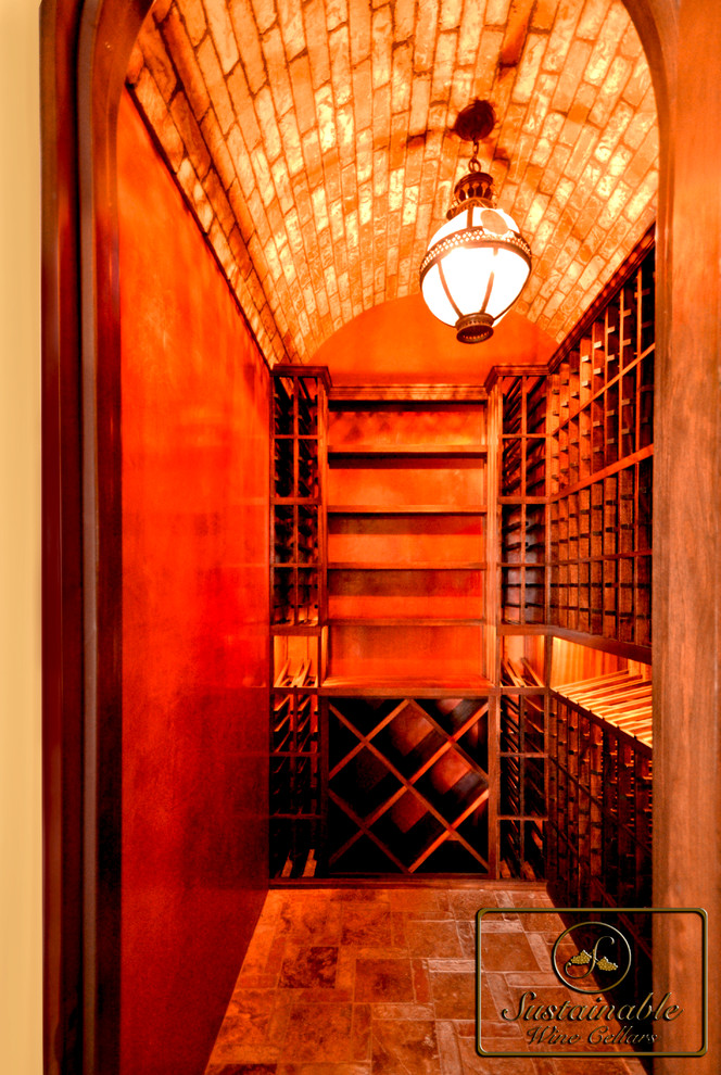 Small mediterranean wine cellar in San Diego with storage racks.