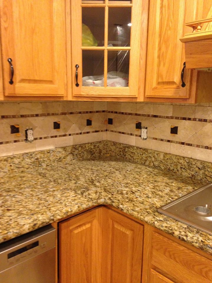 Mid-sized l-shaped open concept kitchen photo with raised-panel cabinets, light wood cabinets, granite countertops, multicolored backsplash, ceramic backsplash and stainless steel appliances