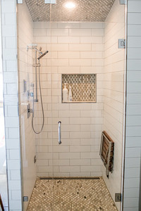 Inspiration for a mid-sized rustic master gray tile and subway tile concrete floor and gray floor freestanding bathtub remodel with shaker cabinets, white cabinets, a two-piece toilet, an undermount sink, granite countertops and a hinged shower door