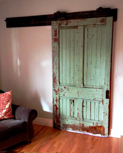 Restored farmhouse door with original antique pocket door sliders