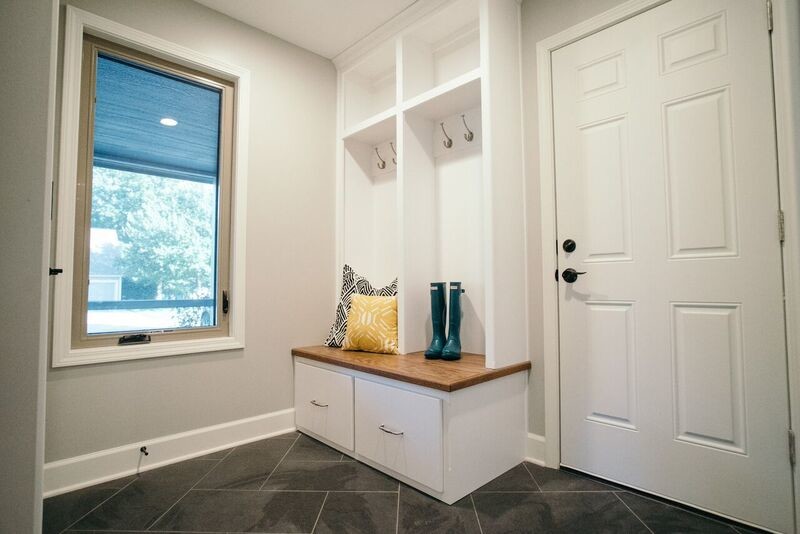 Inspiration for a ceramic tile and gray floor mudroom remodel with gray walls