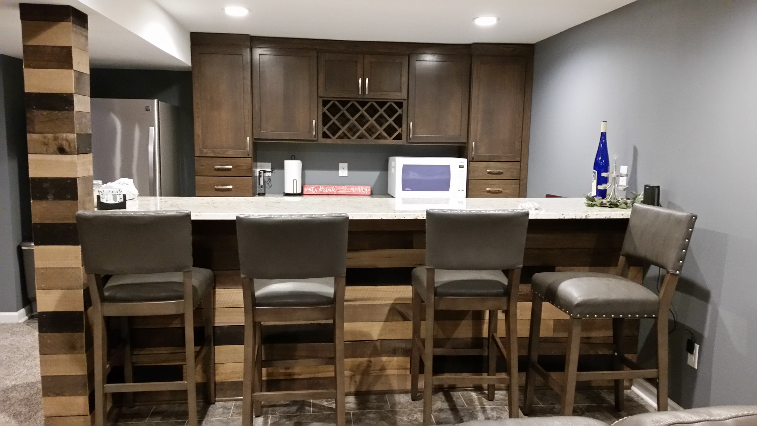 Basement rec room with custom bar and bedroom