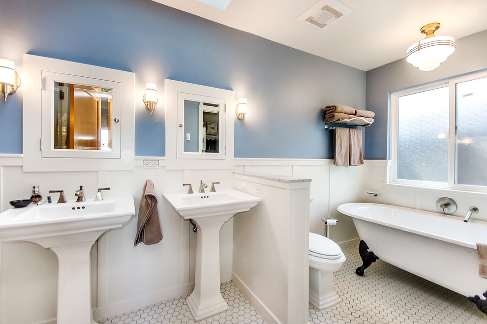 Traditional bathroom in San Francisco with a claw-foot tub and a pedestal sink.