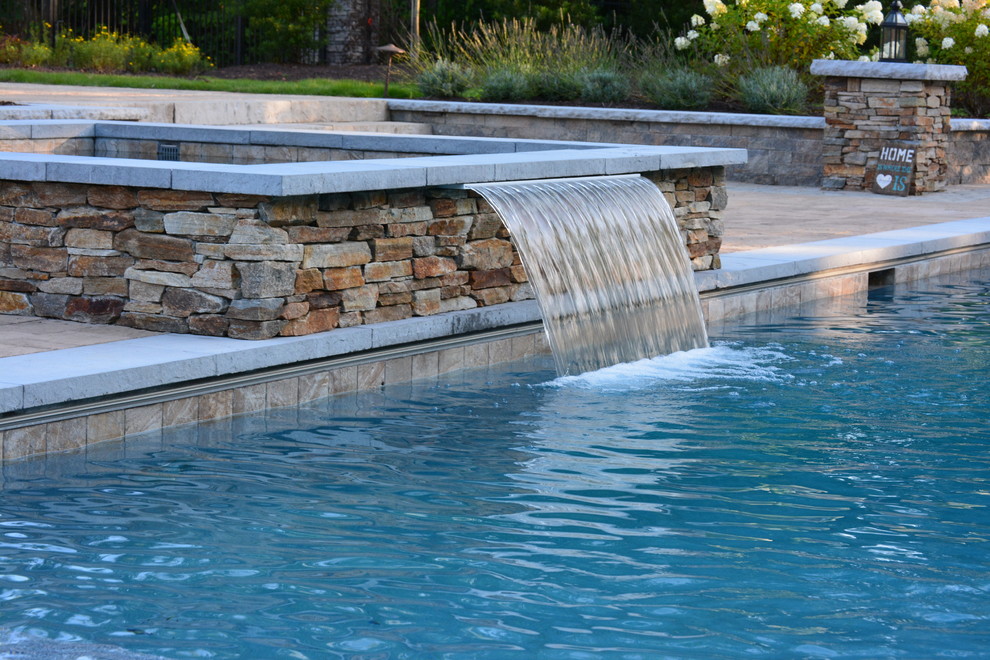 Design ideas for a large arts and crafts backyard rectangular lap pool in Richmond with a hot tub and concrete pavers.