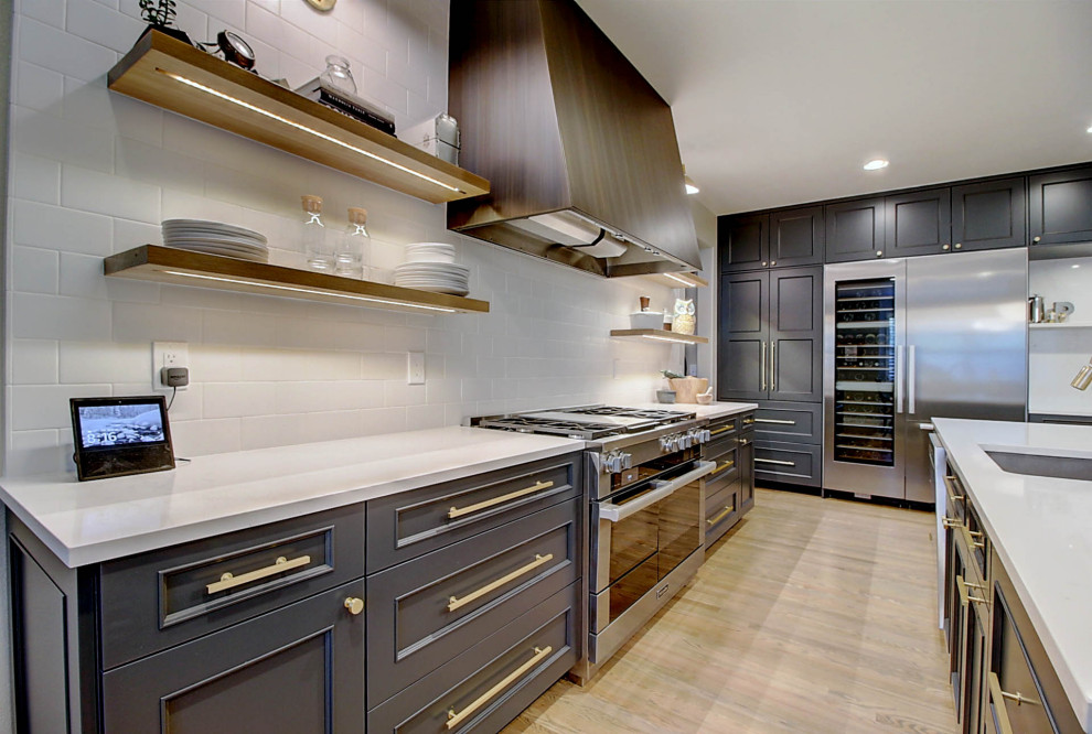 Example of a transitional kitchen design in Denver