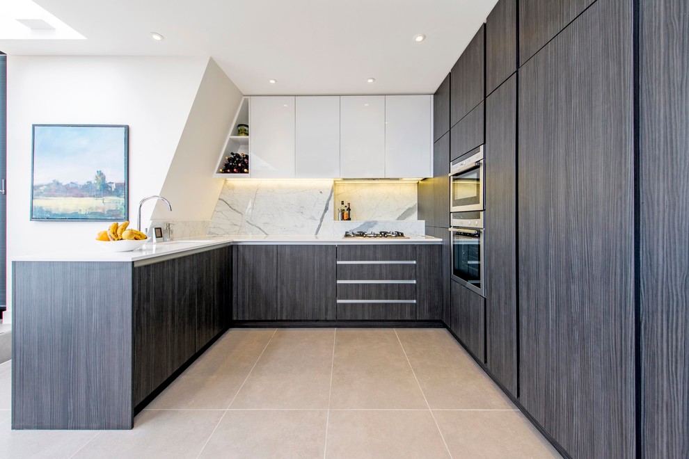 Photo of a contemporary u-shaped kitchen in London with an undermount sink, flat-panel cabinets, dark wood cabinets, marble benchtops, white splashback, stone slab splashback and panelled appliances.