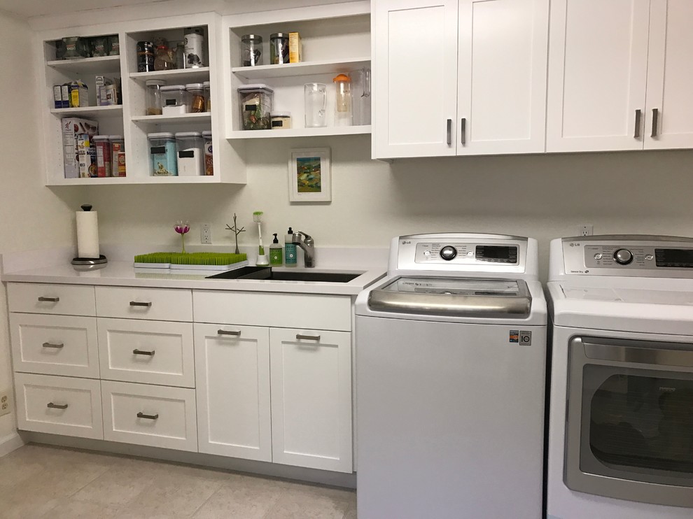Large transitional galley utility room in San Francisco with an undermount sink, shaker cabinets, white cabinets, quartz benchtops, white walls, linoleum floors and a side-by-side washer and dryer.