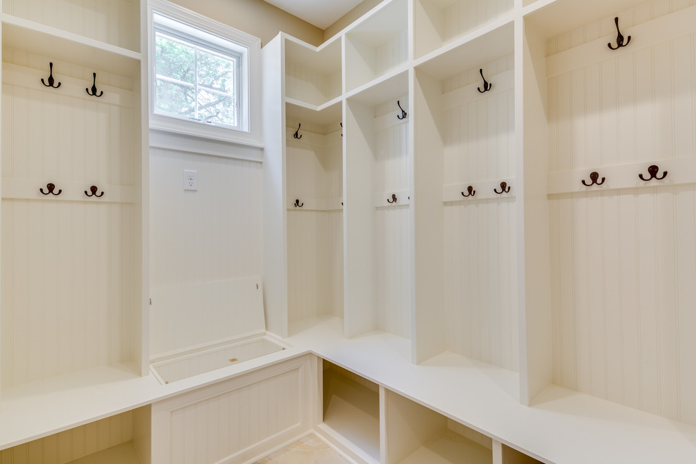 Example of a mid-sized classic gender-neutral walk-in closet design in Baltimore with open cabinets and white cabinets