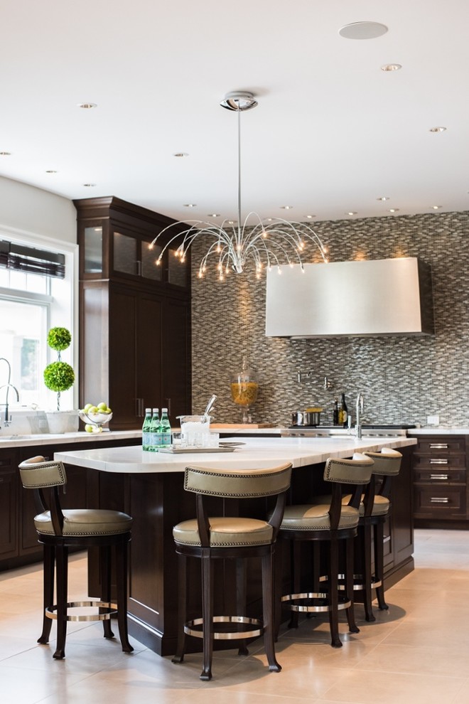 Photo of a large contemporary l-shaped eat-in kitchen in Boston with recessed-panel cabinets, dark wood cabinets and with island.