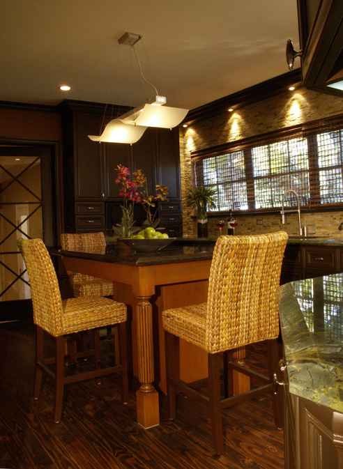 Mid-sized trendy l-shaped dark wood floor kitchen photo in Miami with an undermount sink, raised-panel cabinets, dark wood cabinets, granite countertops, beige backsplash, stone slab backsplash and an island