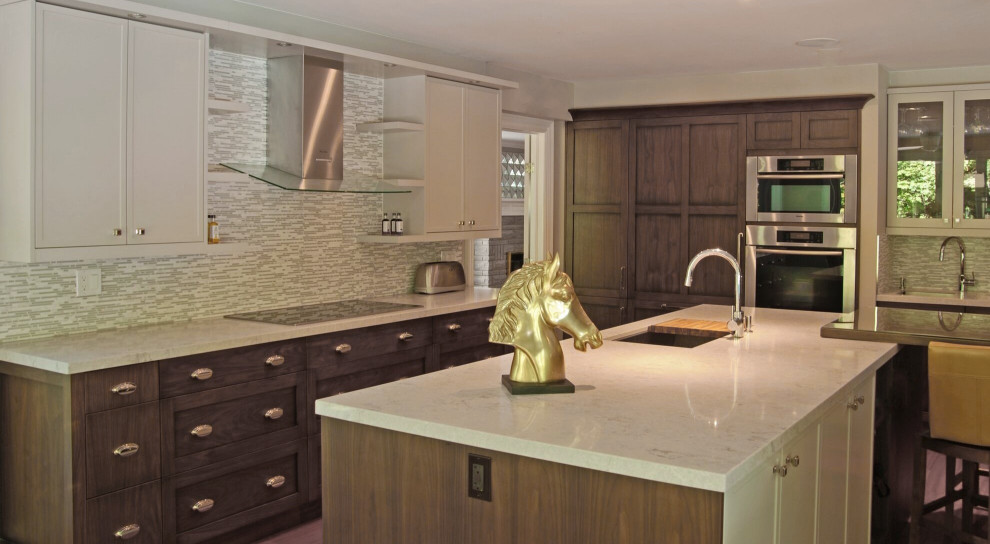 Example of a transitional medium tone wood floor open concept kitchen design with a single-bowl sink, recessed-panel cabinets, quartz countertops, multicolored backsplash, paneled appliances, an island and white countertops