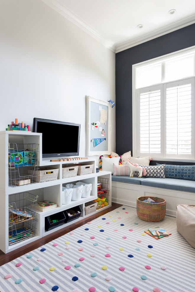 Photo of a mid-sized contemporary gender-neutral kids' playroom for kids 4-10 years old in Los Angeles.
