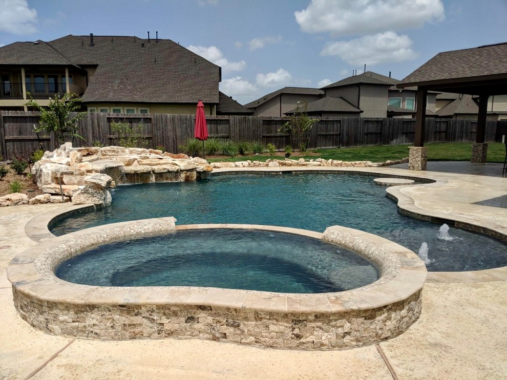 Inspiration for a backyard custom-shaped pool in Houston.