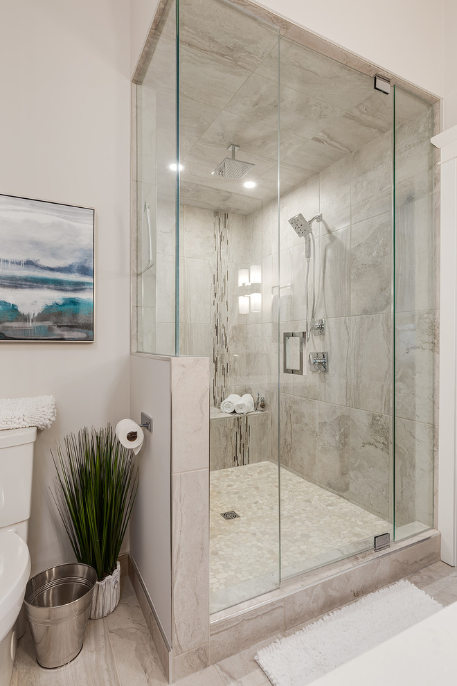 Large transitional master wet room bathroom in Calgary with furniture-like cabinets, medium wood cabinets, gray tile, glass tile, grey walls, marble floors, an undermount sink and engineered quartz benchtops.