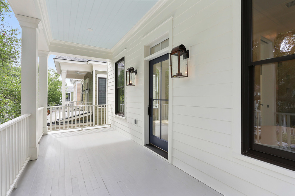Design ideas for a mid-sized country home design in Charleston.