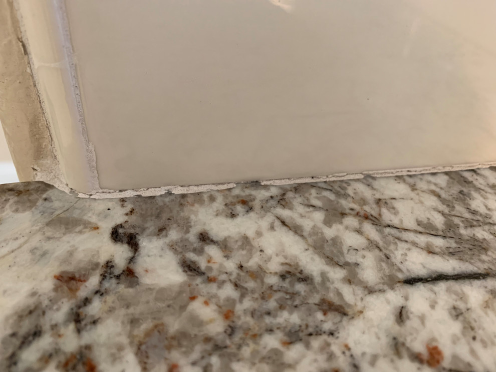 Grout Cracking (Kitchen Counter + Backsplash area)
