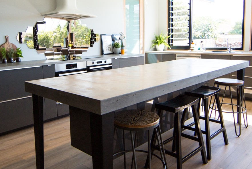 Photo of a mid-sized contemporary single-wall eat-in kitchen in Geelong with with island, concrete benchtops and grey benchtop.
