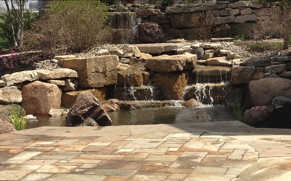 Inspiration for a mid-sized rustic partial sun backyard gravel formal garden for spring.