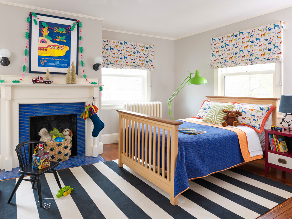 Mid-sized transitional kids' bedroom in Boston with grey walls, medium hardwood floors and brown floor for kids 4-10 years old and boys.