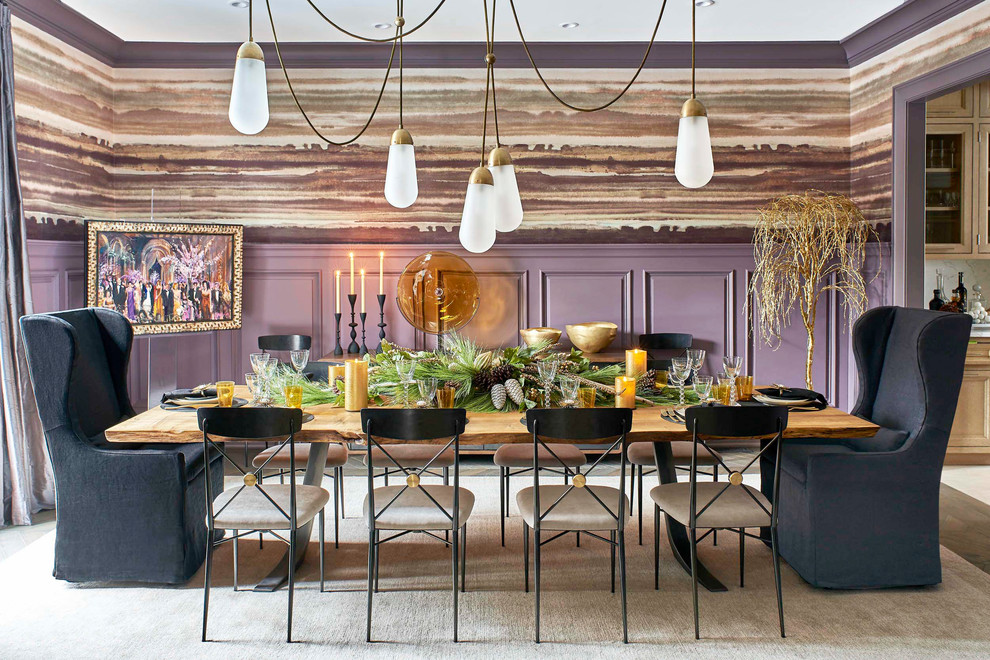 This is an example of an eclectic separate dining room in New York with purple walls.