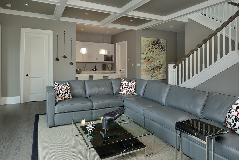 Inspiration for a traditional family room in Toronto with grey walls and grey floor.