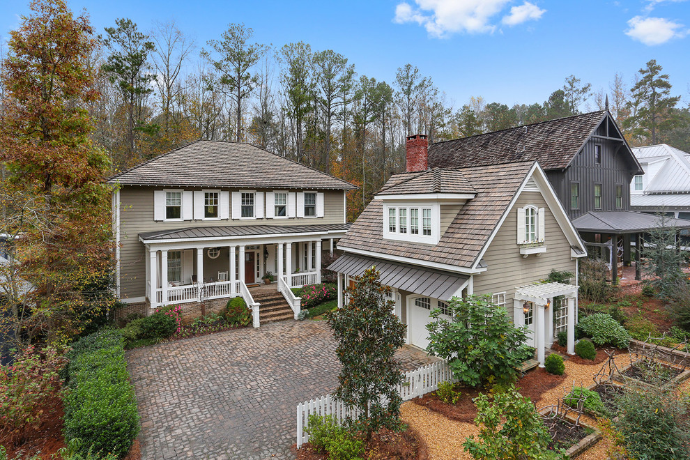 Large traditional two-storey grey exterior in Atlanta with wood siding.