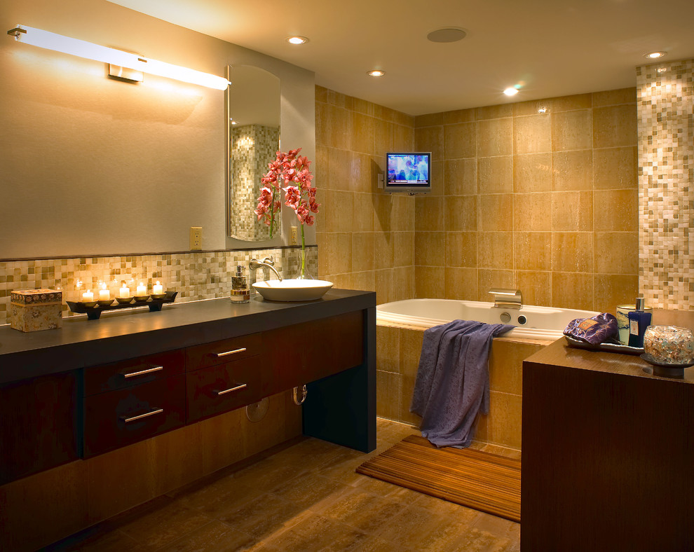 Photo of a contemporary bathroom in Miami with a vessel sink and a drop-in tub.