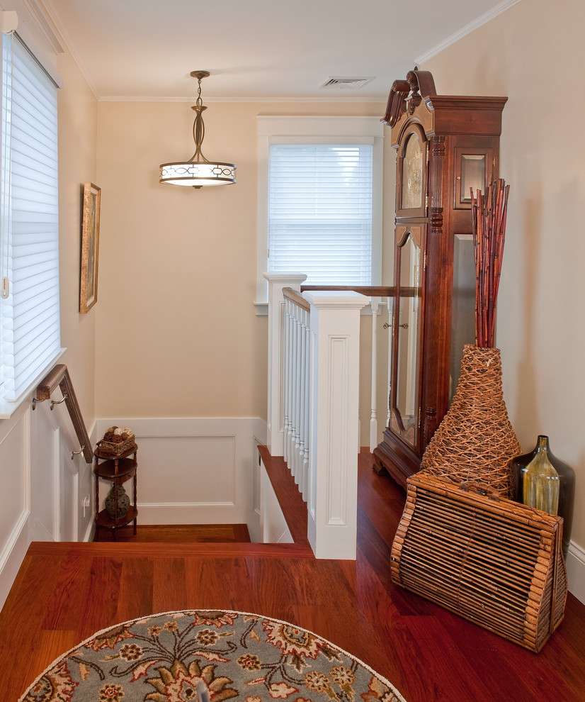 Design ideas for a mid-sized transitional wood l-shaped staircase in Other with wood risers and wood railing.