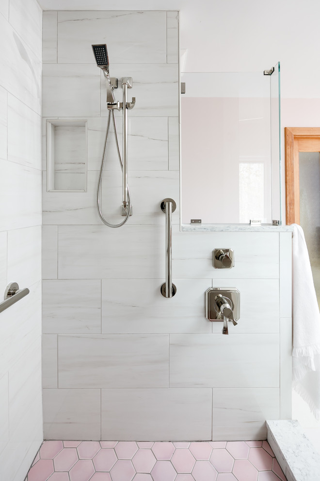 Photo of a mid-sized contemporary master bathroom in Louisville with flat-panel cabinets, medium wood cabinets, a freestanding tub, a double shower, a one-piece toilet, white tile, glass tile, pink walls, porcelain floors, an undermount sink, engineered quartz benchtops, white floor, a hinged shower door and white benchtops.