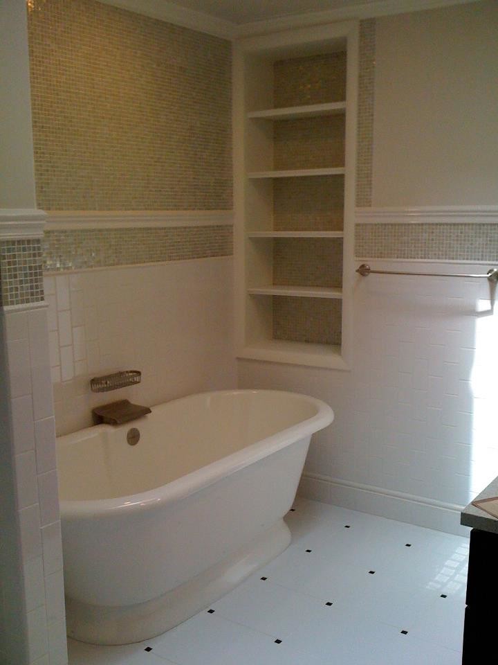 Inspiration for a large white tile ceramic tile freestanding bathtub remodel with open cabinets and white walls