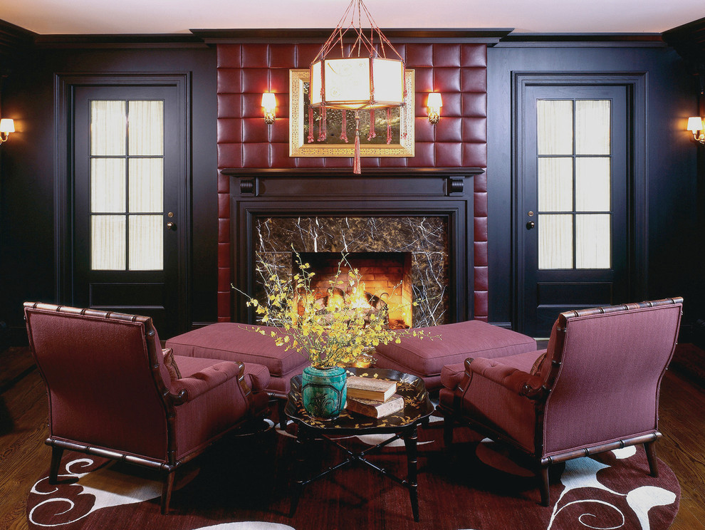 This is an example of a contemporary living room in New York with dark hardwood floors and a standard fireplace.