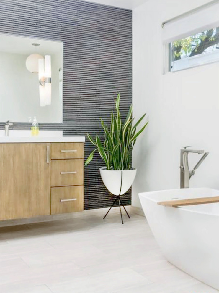 Large modern master bathroom in Phoenix with flat-panel cabinets, medium wood cabinets, a freestanding tub, a corner shower, a one-piece toilet, white walls, an undermount sink, engineered quartz benchtops, beige floor, a hinged shower door, yellow benchtops, a double vanity, a floating vanity and wallpaper.