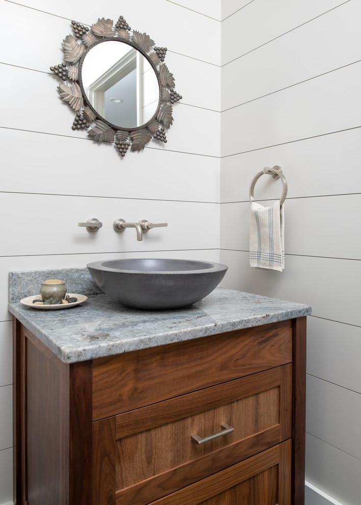 This is an example of a small country powder room in Burlington with furniture-like cabinets, brown cabinets, white walls, a vessel sink, granite benchtops and blue benchtops.