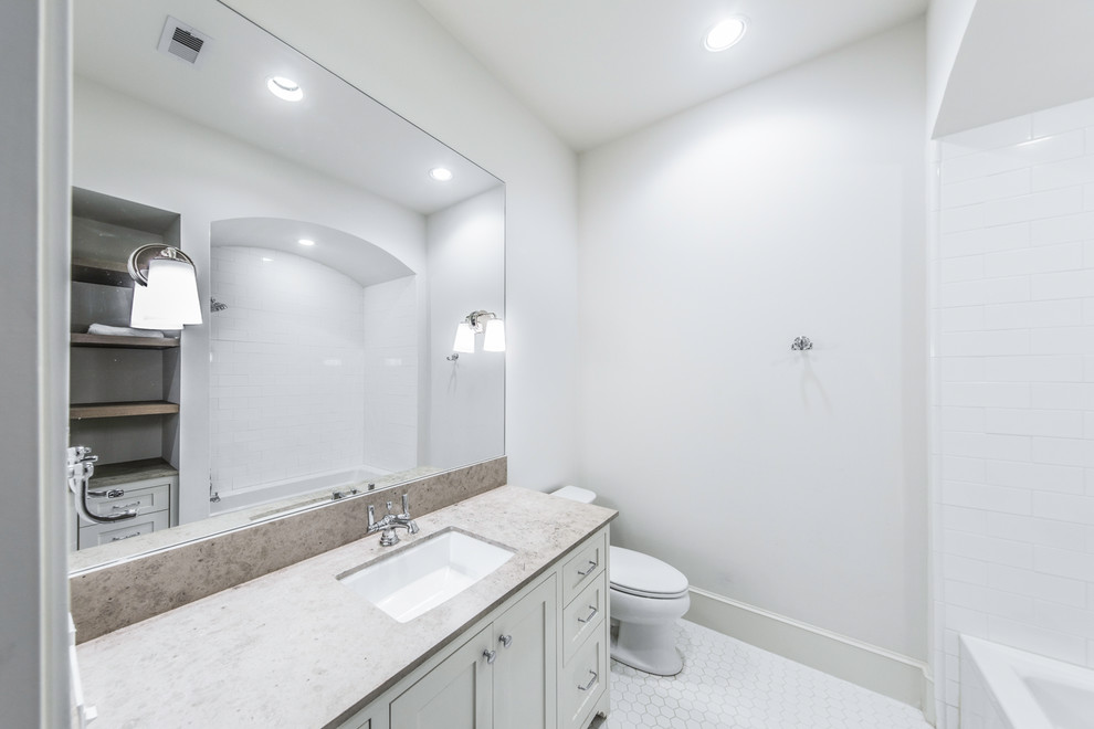 Design ideas for a large mediterranean 3/4 bathroom in Houston with open cabinets, dark wood cabinets, a corner tub, an open shower, a one-piece toilet, white tile, ceramic tile, grey walls, light hardwood floors, a drop-in sink, concrete benchtops, beige floor and an open shower.