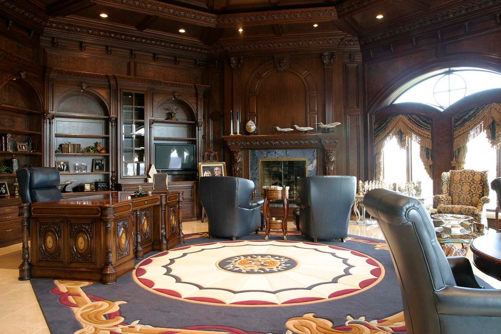 Photo of a large traditional study room in Orange County with brown walls, ceramic floors, a standard fireplace, a tile fireplace surround and a freestanding desk.