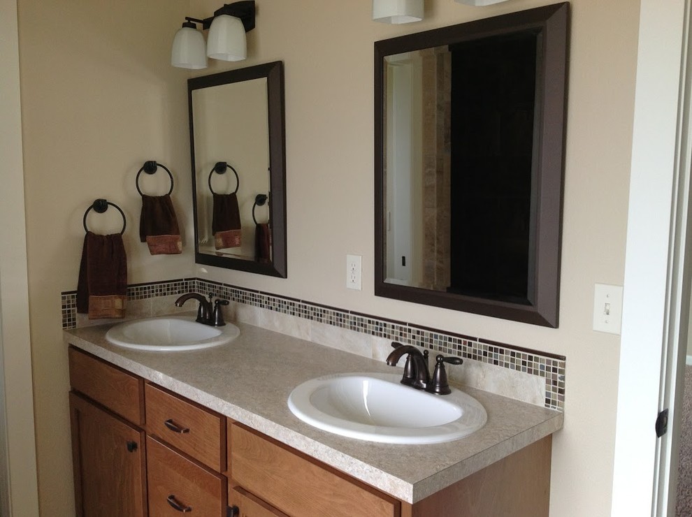 Inspiration for a mid-sized transitional 3/4 multicolored tile and mosaic tile bathroom remodel with flat-panel cabinets, light wood cabinets, beige walls and a drop-in sink