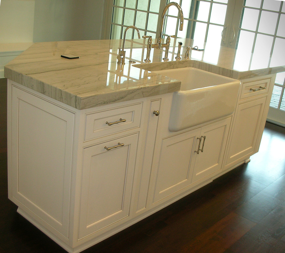 Inspiration for a dark wood floor eat-in kitchen remodel in Miami with a farmhouse sink, beaded inset cabinets, white cabinets, quartzite countertops, paneled appliances and an island