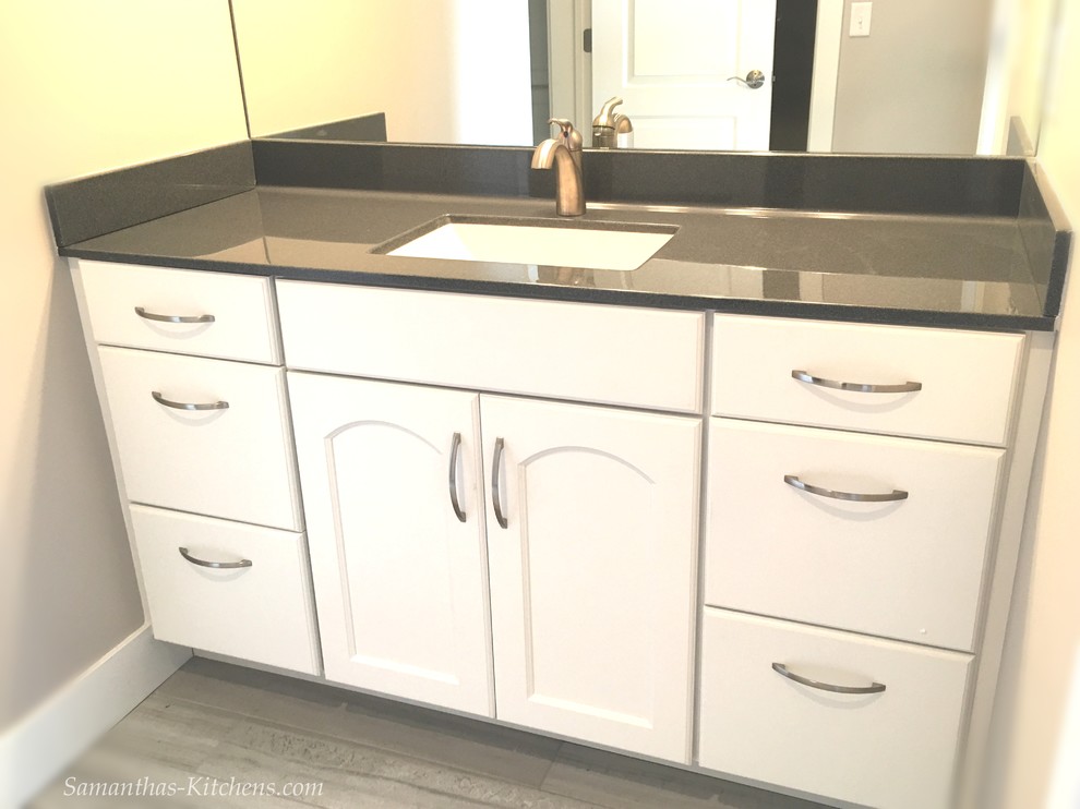 Mid-sized transitional kids' porcelain tile home design photo with recessed-panel cabinets, white cabinets, beige walls, an integrated sink and marble countertops