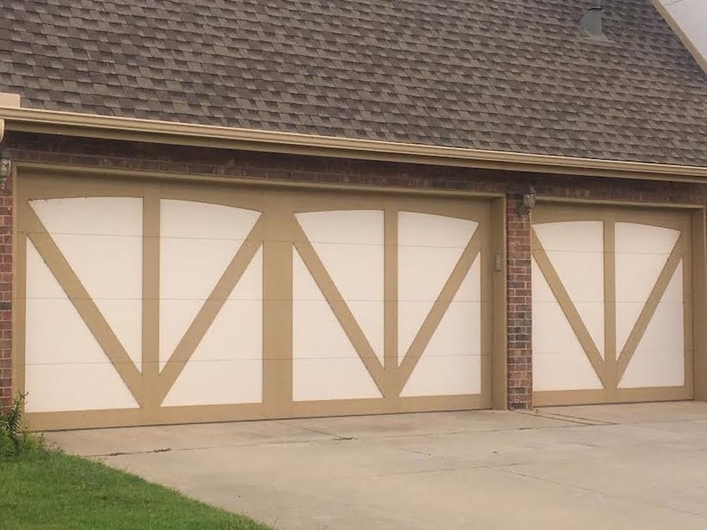This is an example of a mid-sized country attached three-car garage in Oklahoma City.