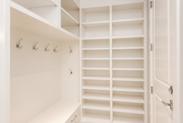 Inspiration for a mid-sized transitional walk-in wardrobe in Other with white cabinets.