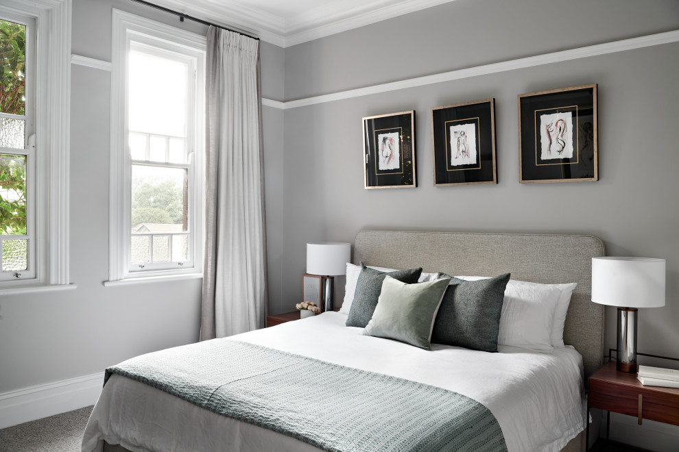 This is an example of a mid-sized transitional master bedroom in Sydney with grey walls, carpet and grey floor.