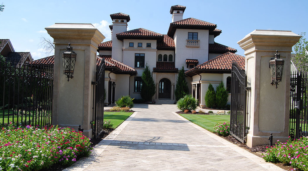 This is an example of a mediterranean white exterior in Charlotte.