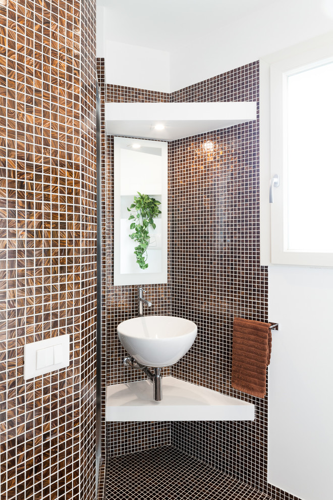Small contemporary bathroom in Cagliari with mosaic tile, a vessel sink, brown tile, brown walls, mosaic tile floors, brown floor and white benchtops.