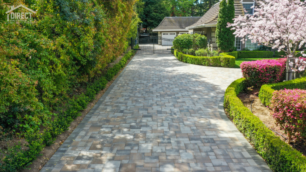 Photo of a traditional front driveway garden in San Francisco with natural stone paving.