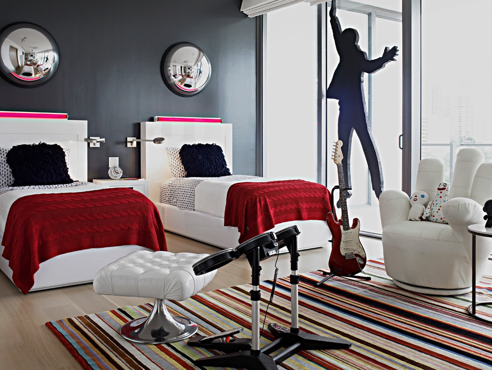 Example of a trendy gender-neutral medium tone wood floor kids' room design in Miami with black walls
