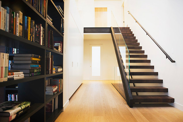 Design ideas for a modern wood floating staircase in Salt Lake City with open risers.
