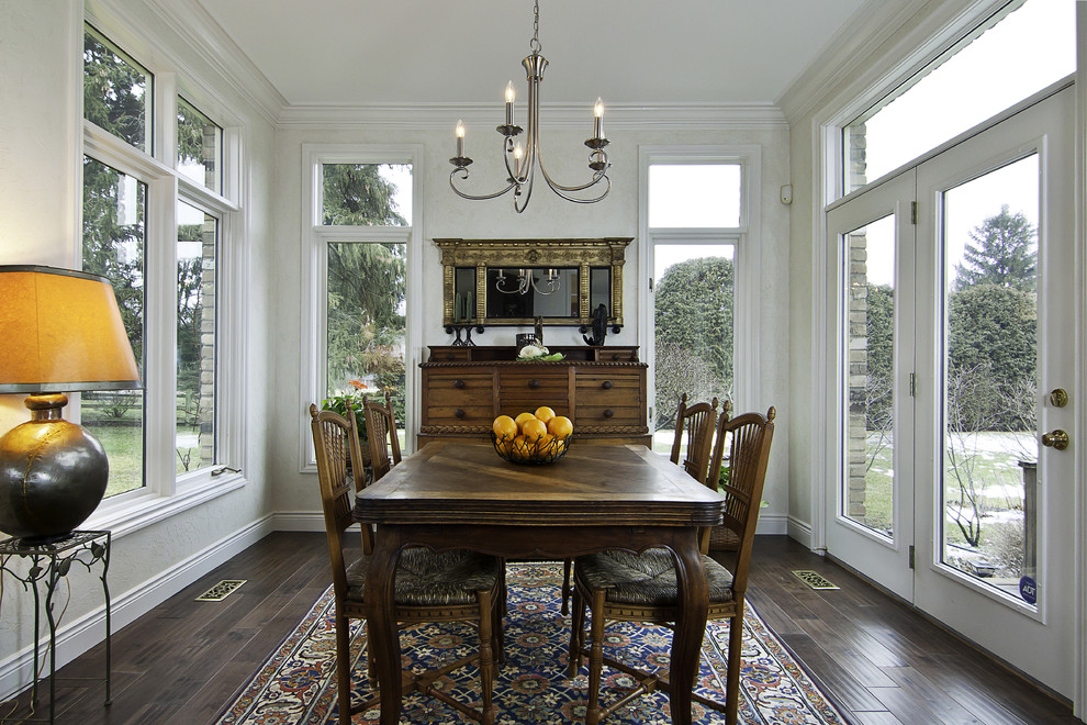 Traditional dining room in Other with white walls.