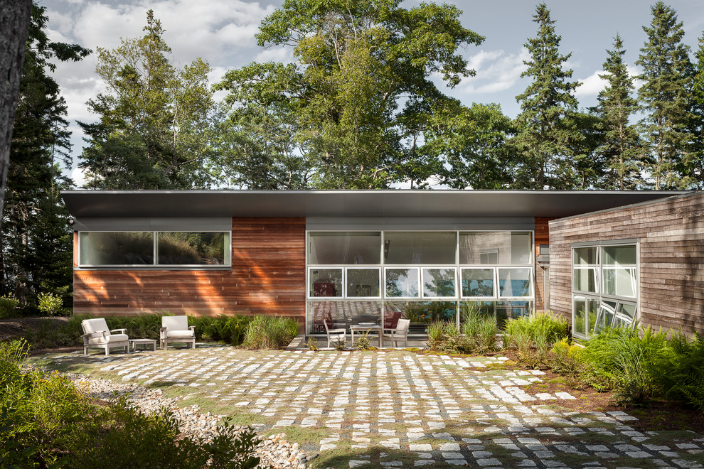 Inspiration for a modern exterior in Portland Maine with wood siding.