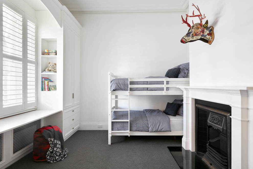 Mid-sized traditional gender-neutral storage and wardrobe in Melbourne with raised-panel cabinets, white cabinets, carpet and grey floor.